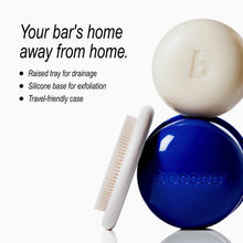 Beecee exfoliating bar set featuring a deep blue round container, a cream-colored exfoliating bar with a 'b' logo, a white silicone scraper brush, and a raised drainage tray, set against a clean white background with promotional text.