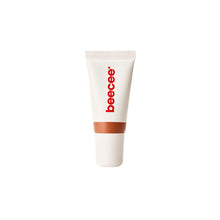 A white squeeze tube of beecee lip gloss with a red vertical logo and a brown band near the base, centered on a plain white background.