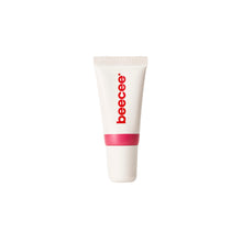 A white squeeze tube of beecee lip gloss with a pink band and red brand name, centered on a plain white background.