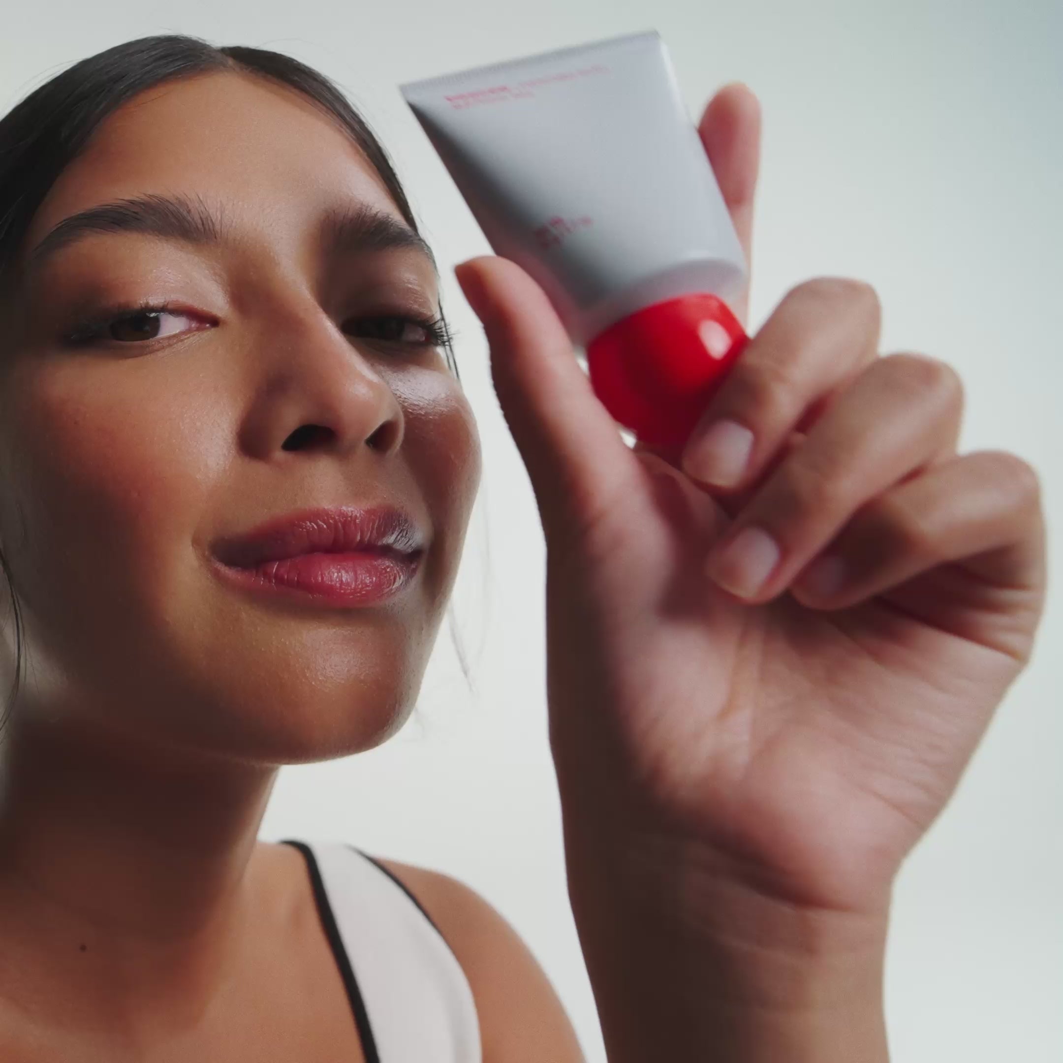 Video of different girls applying everything balm to their faces. 